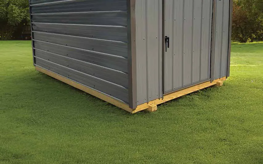 Gray metal building on the lawn, a style only sold in NC, SC and VA