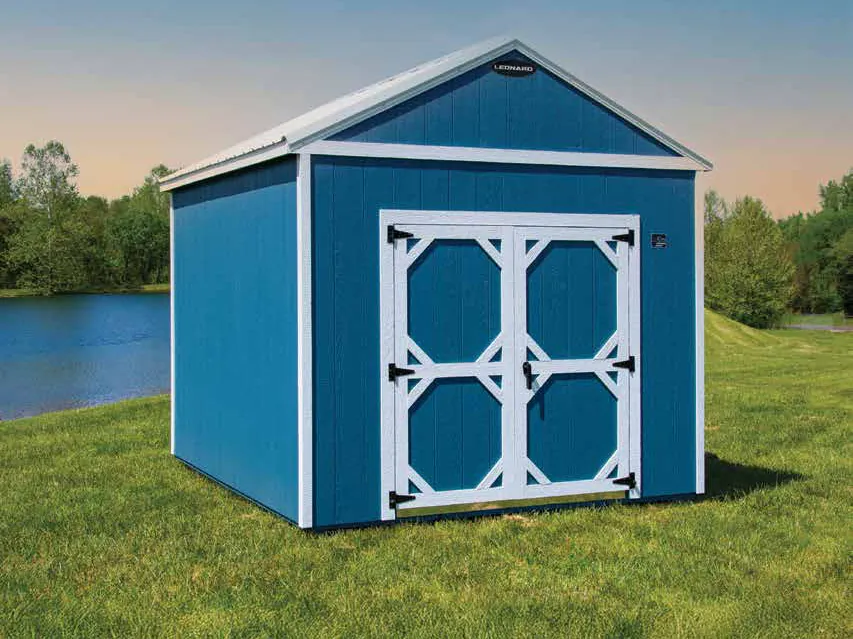 Blue storage shed with white double doors beside the water, the kind stocked on the Ocean Springs, MS lot
